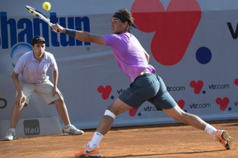 Rafael Nadal returns the ball to Federico Delbonis in his first singles match since Wimbledon 2012.