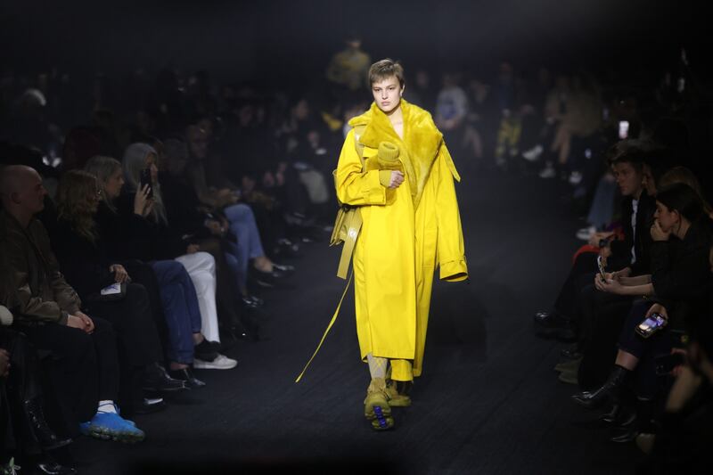 A pop of yellow as an oversized trench coat. Bloomberg