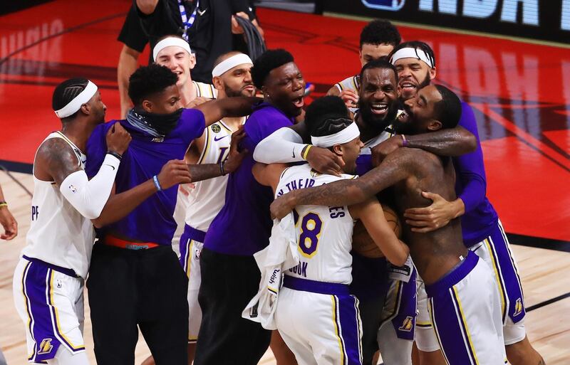 The  Lakers celebrate victory. AFP