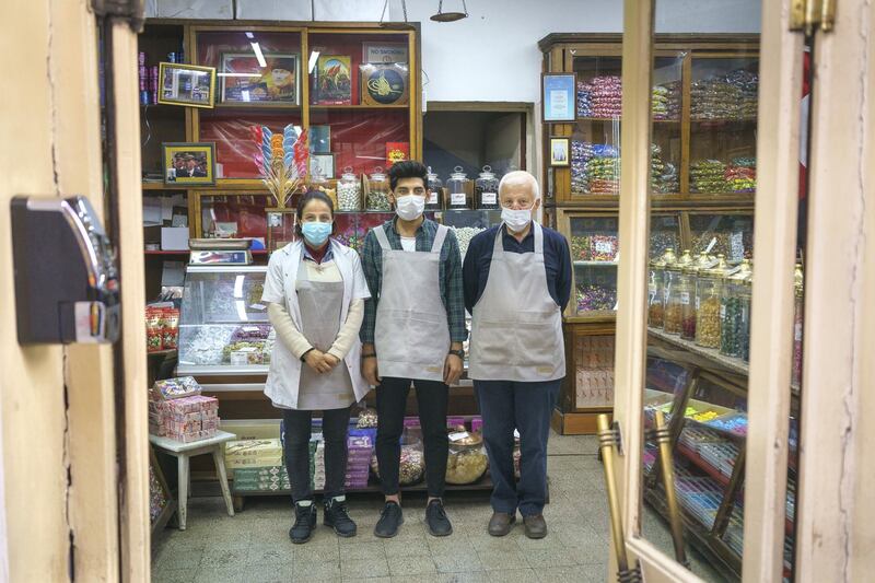 Derya (Left) and Adem ( Right) poses for a picture. “Altan Sekerleme” works as traditional Ottoman style confectioners. Turkish delight, hard candy, marzipan, cheese sugar, sherbet sugar, halva varieties and Ottoman drinks called sherbets are their main products. 

They still continue to produce boutique traditional production. They make the candies in their own factory. The workshop is on the upper floor of the shop. The shop has been in the same place for over 150 years. In Eminönü Kantarcılar, Istanbul Turkey 2021.