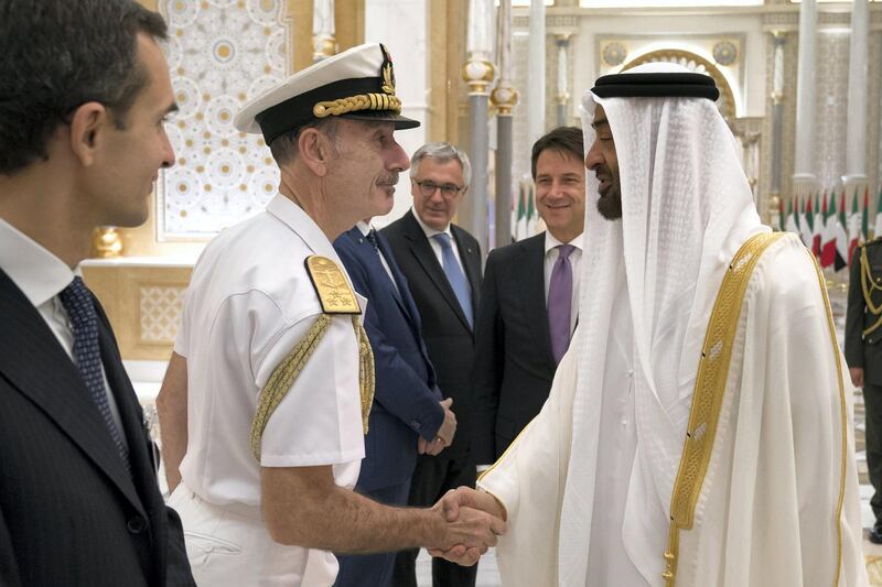 ABU DHABI, UNITED ARAB EMIRATES - November 15, 2018: HH Sheikh Mohamed bin Zayed Al Nahyan Crown Prince of Abu Dhabi Deputy Supreme Commander of the UAE Armed Forces (R), greets a delegation member accompanying HE Giuseppe Conte, Prime Minister of Italy (back R), during a reception held at the Presidential Palace. 

( Hamad Al Kaabi / Ministry of Presidential Affairs )?
---