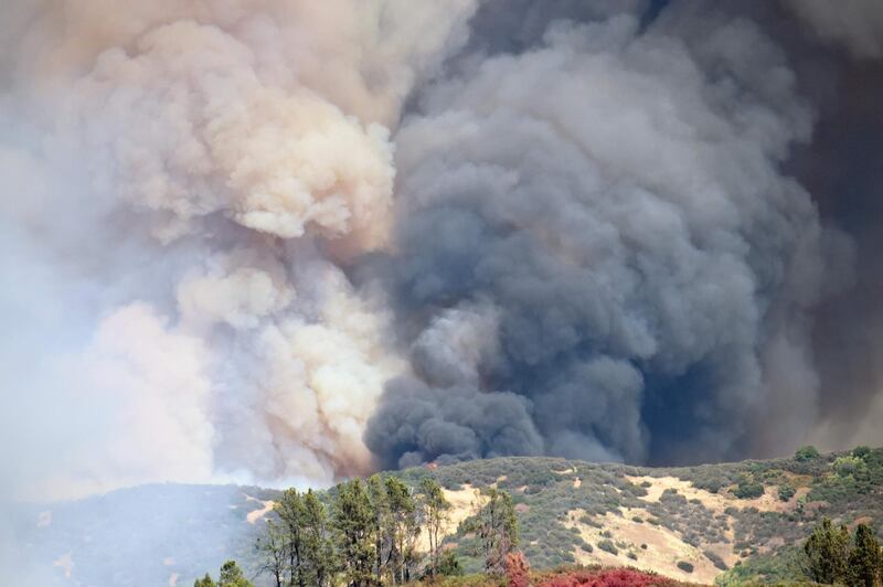 Smoke billows up as the Mendocino Complex fire expands near Finley, California. AFP PHOTO / JOSH EDELSON
