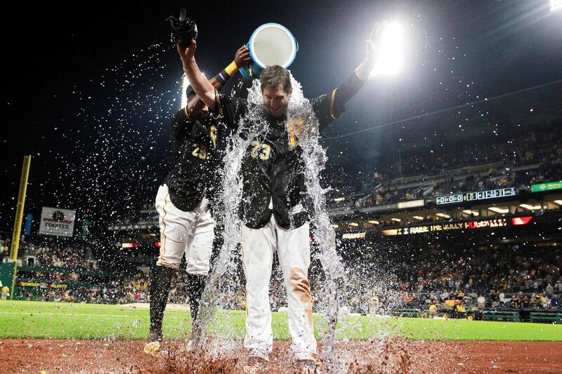 Pittsburgh Pirates first baseman David Freese has water dumped on him after hitting a walk-off single to win the game against the New York Mets at PNC Park, Pittsburgh. Charles LeClaire/Reuters