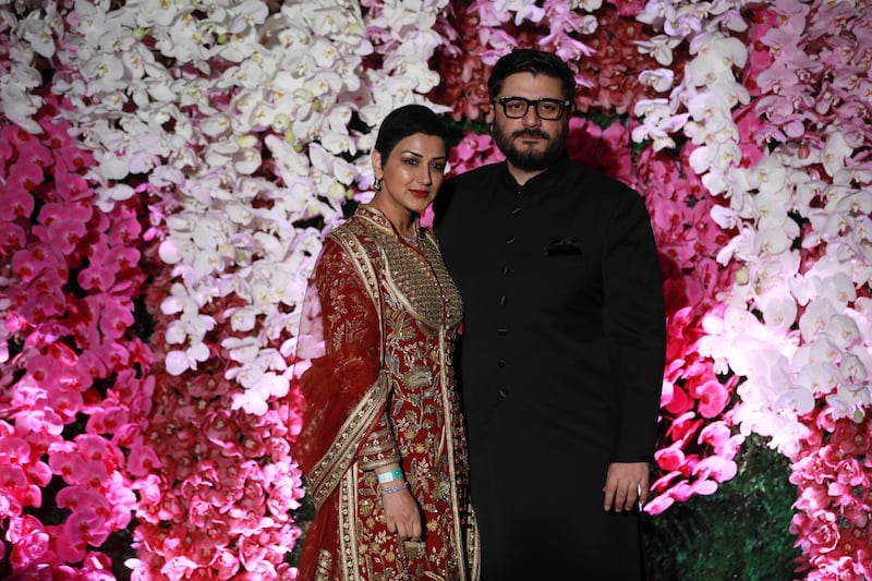 Sonali Bendre (L) and her husband Goldie Behl. Photo: EPA