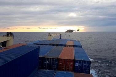A screen grab from a video released by Demiroren News Agency shows a German soldier landing from a helicopter on a Turkish cargo ship in the eastern Mediterranean Sea on November 23, 2020. AFP / Demiroren News Agency