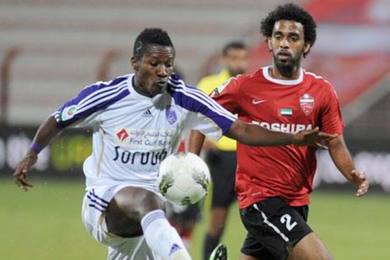 Asamoah Gyan, left, the Al Ain forward who is on loan from Sunderland, scored an acrobatic goal against Al Ahli on Tuesday night.