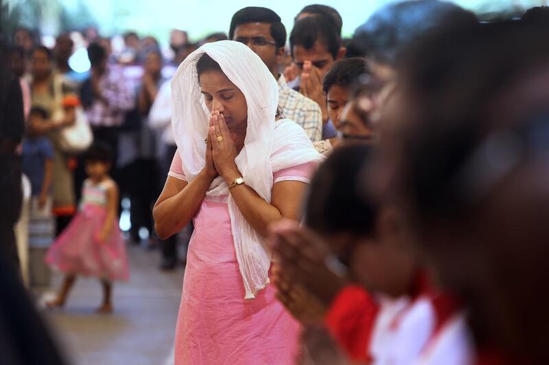 Some of the many worshippers at Good Friday mass at St Joseph’s Cathedral in Abu Dhabi on Friday.  Delores Johnson / The National