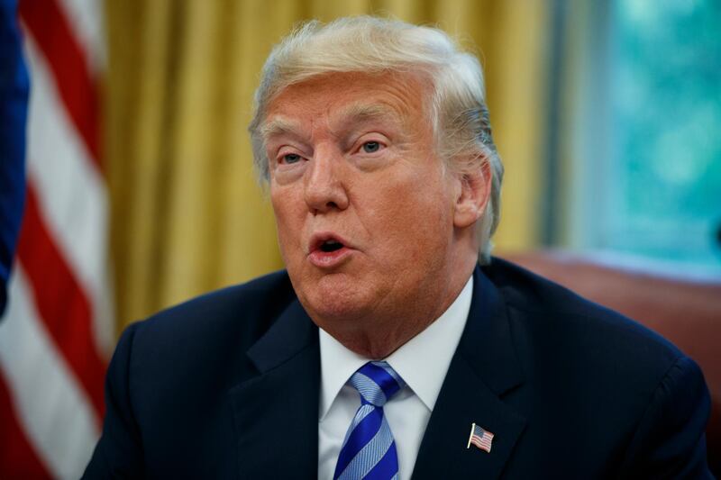 FILE - In this Tuesday, Aug. 28, 2018, file photo, President Donald Trump speaks during a meeting in the Oval Office of the White House, in Washington. Lawyers for Trump have asked a judge to dismiss a lawsuit brought against his charitable foundation by New Yorkâ€™s attorney general, arguing that it was politically motivated. Attorney Alan Futerfas argued in a motion filed late Thursday, Aug. 30, 2018, that former Attorney General Eric Schneiderman used his public antipathy for Trump to solicit campaign donations. (AP Photo/Evan Vucci, File)