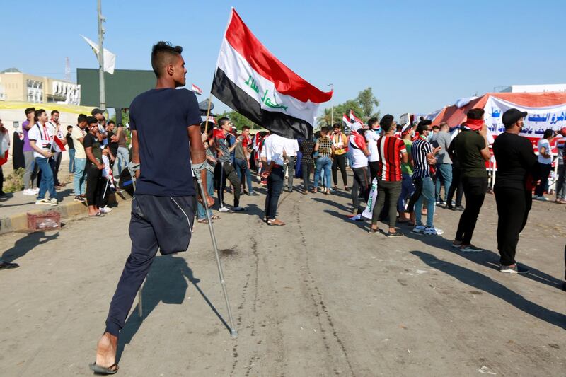 A demonstrator arrives to attend an anti-government protest in Najaf. Reuters