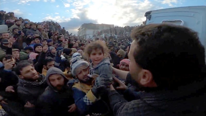 A family is rescued from rubble in Bisnia, Syria, February 7. The White Helmets / Reuters