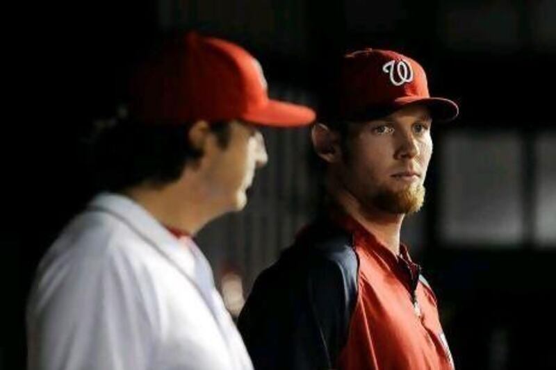 The Washington Nationals’ Stephen Strasburg, right, will need to get used to the view from the dugout.