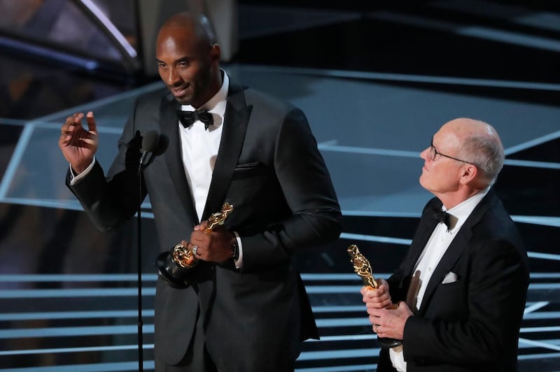Kobe Bryant and Glen Keane (R) accept the Oscar for Best Animated Short Film for 'Dear Basketball.' Lucas Jackson / Reuters
