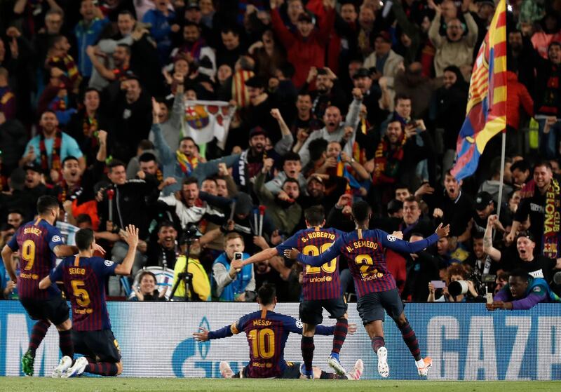 Lionel Messi celebrates scoring their third goal. Joan Monfort / AP Photo