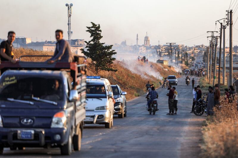 Syrian demonstrators near the Turkish army observation point in Ibbin Samaan. AFP