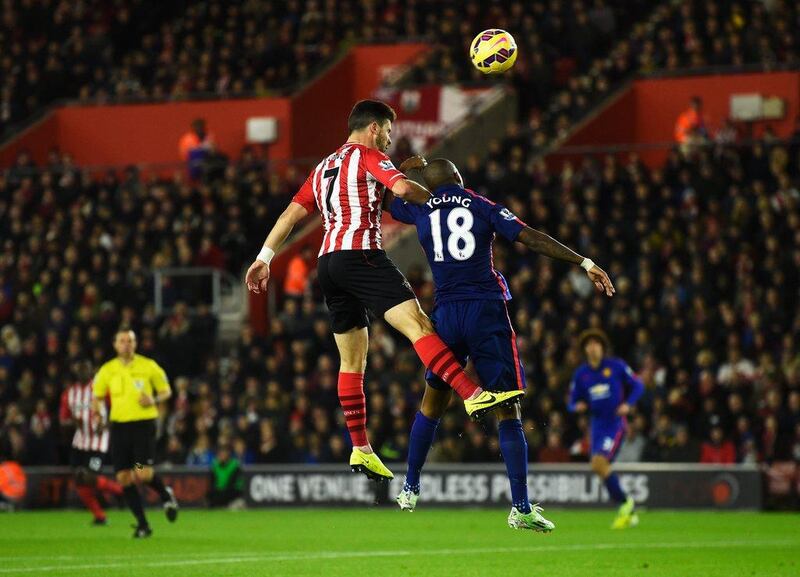 Shane Long of Southampton jumps for a header with Ashley Young of Manchester United during their Premier League match on Monday night. Mike Hewitt / Getty Images