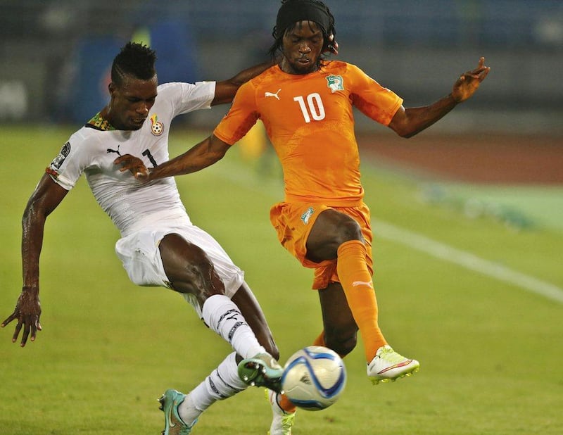 Ghana's Mubarak Wakaso, left, challenges Ivory Coast's Gervinho during the 2015 Africa Cup of Nations final on Sunday in Equatorial Guinea. Mike Hutchings / Reuters
