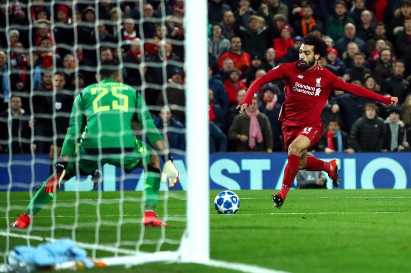 LIVERPOOL, ENGLAND - DECEMBER 11:  Mohamed Salah of Liverpool scores his team's first goal past David Ospina of Napoli during the UEFA Champions League Group C match between Liverpool and SSC Napoli at Anfield on December 11, 2018 in Liverpool, United Kingdom.  (Photo by Clive Brunskill/Getty Images)