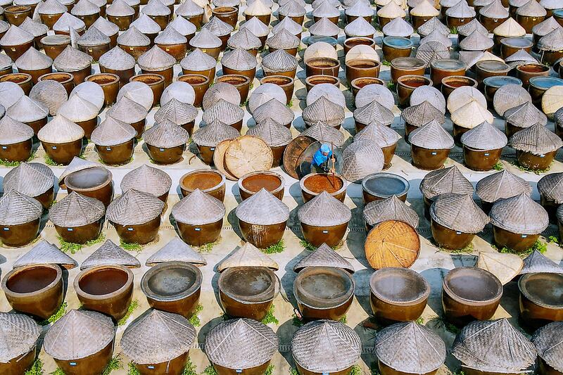 A worker produces soya sauce in Rugao, in China's eastern Jiangsu province. AFP