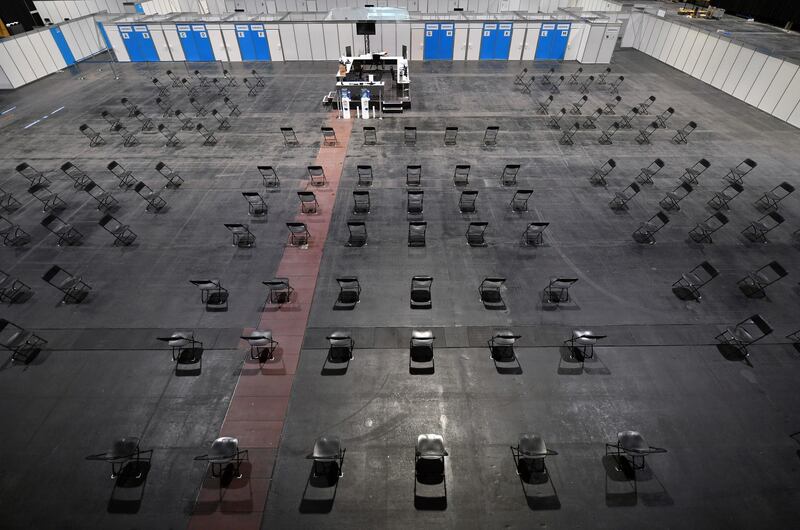 The vaccination centre at the Erfurt exhibition centre in Germany is deserted. After the suspension of AstraZeneca vaccinations, thousands of appointments were cancelled in Thuringia. AP Photo