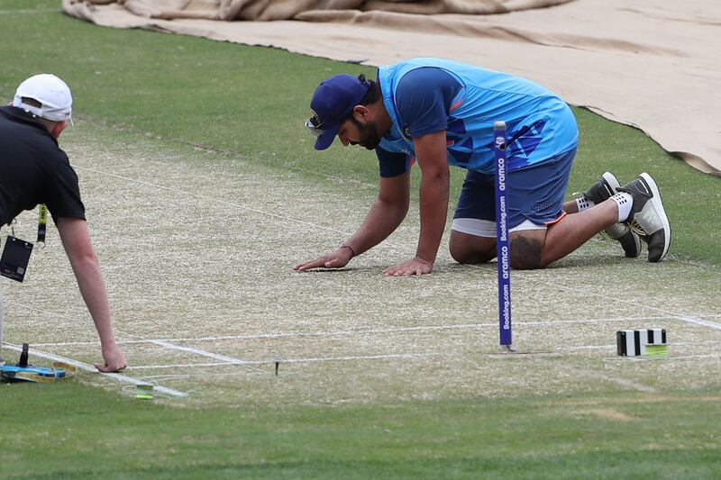 Rohit Sharma inspects the wicket before the start of a practice session at the Melbourne Cricket Ground. AFP