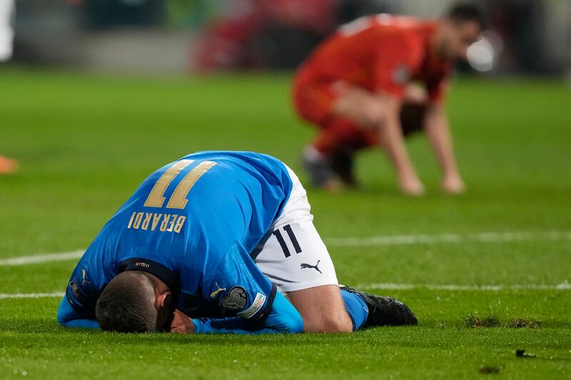 Italy's Domenico Berardi on his knees after missing a chance. AP