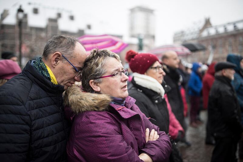 Residents react during the gathering being held in a central square of Strasbourg. AP Photo