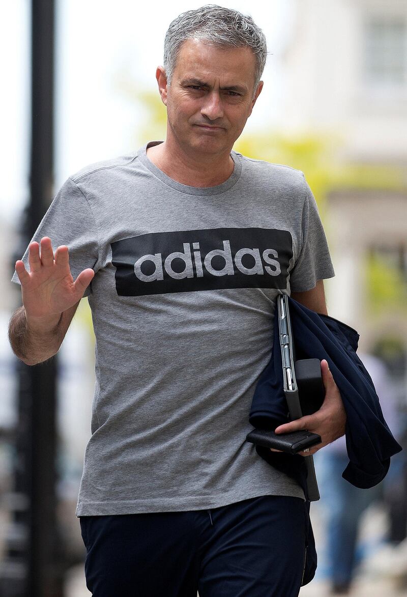 Manchester United's new Portuguese manager Jose Mourinho waves as he returns to his home in central London on May 27, 2016.
Manchester United on Friday anointed Jose Mourinho as their new manager to launch a third bid in less than three years to transform the Red Devils into a title-winning force again. After three days of talks, Mourinho agreed a three-year contract on a bumper salary reportedly worth more than $20 million (19.5 million euros) a year. / AFP PHOTO / JUSTIN TALLIS