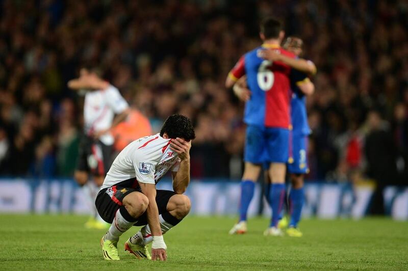 Luis Suarez reacts after his Liverpool's 3-3 draw against Crystal Palace on May 5. Jamie McDonald / Getty Images 