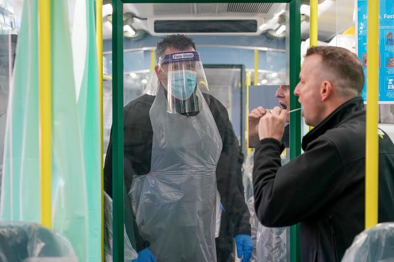 Railway staff carry out lateral flow covid tests on colleagues in a temporary testing facility on a converted train parked on platform eight of Brighton railway station in Brighton, England. Getty Images