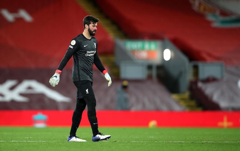 LIVERPOOL, ENGLAND - JANUARY 21: Alisson Becker of Liverpool looks dejected following defeat in the Premier League match between Liverpool and Burnley at Anfield on January 21, 2021 in Liverpool, England. Sporting stadiums around the UK remain under strict restrictions due to the Coronavirus Pandemic as Government social distancing laws prohibit fans inside venues resulting in games being played behind closed doors. (Photo by Clive Brunskill/Getty Images)