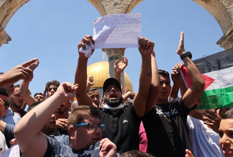 Demonstrators protest over the death of Nizar Banat at the Al Aqsa mosque compound after Friday prayers on June 25, 2021. AFP