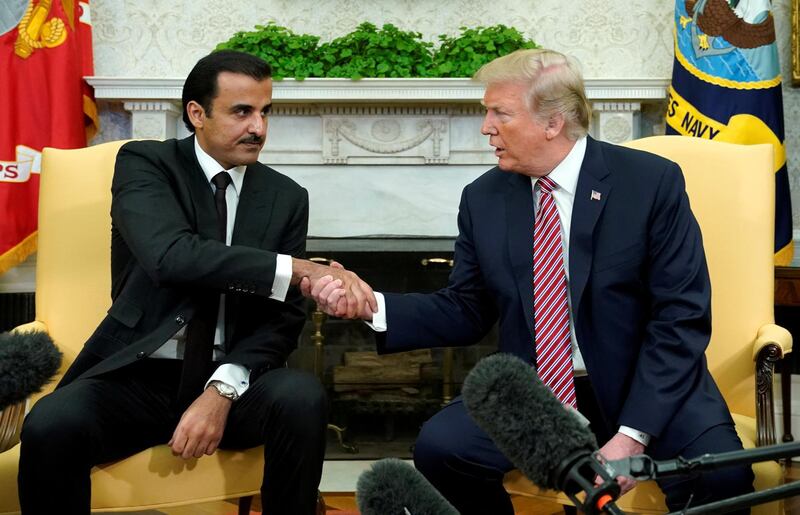 FILE PHOTO: U.S. President Donald Trump meets Qatar's Emir Sheikh Tamim bin Hamad al-Thani in the Oval Office at the White House in Washington, DC, U.S., April 10, 2018.  REUTERS/Kevin Lamarque/File Photo