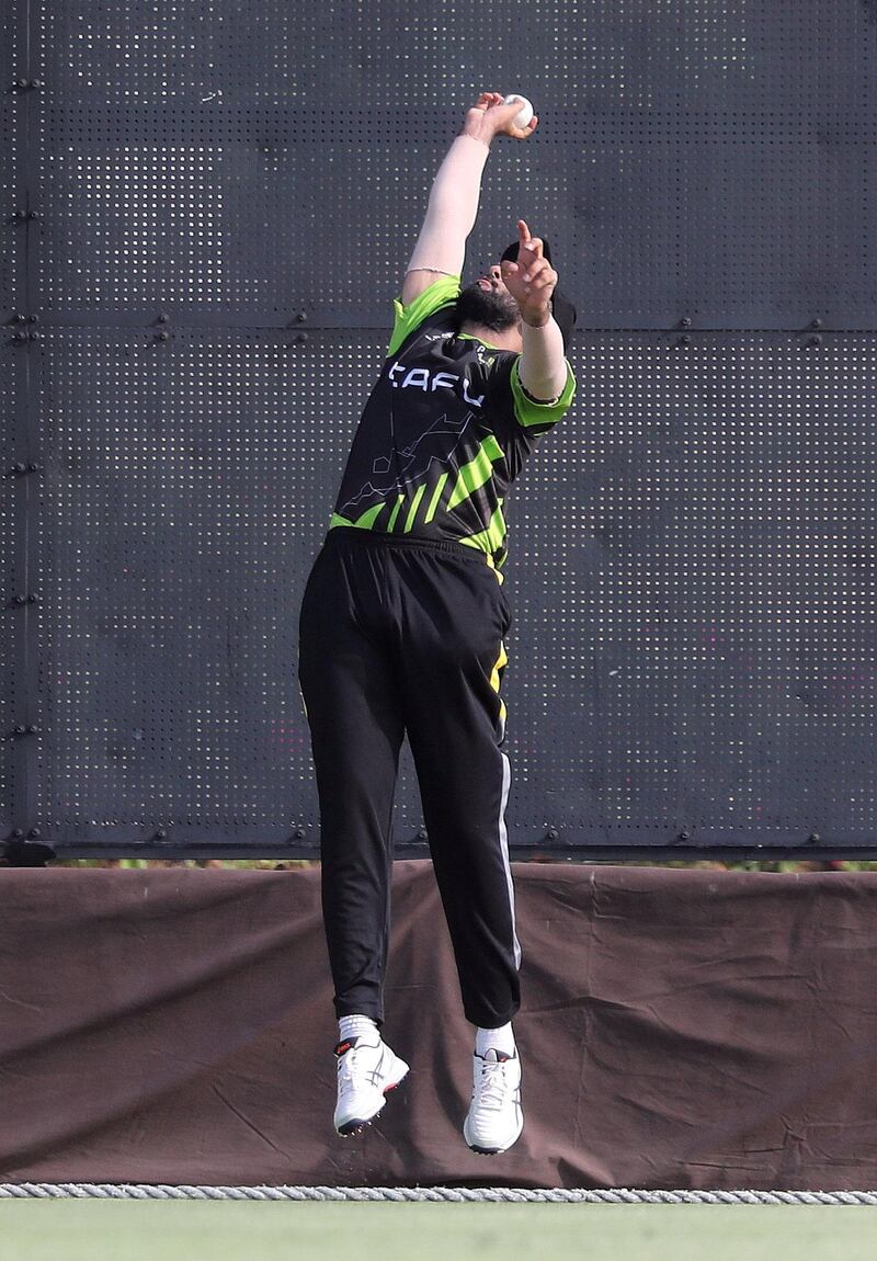 Dubai, United Arab Emirates - Reporter: Paul Radley. Sport. Cricket. Dubai's Mohammad Rashid catches Abu Dhabi's Kai Smith during the game between Abu Dhabi and Dubai in the Emirates D10. Wednesday, July 29th, 2020. Dubai. Chris Whiteoak / The National