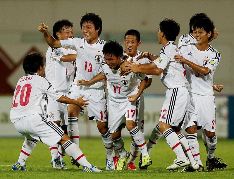 Kosei Uryu, second left, scored the goal that resulted in Japan winning their opening Group D game at Russia’s expense. Satish Kumar / The National