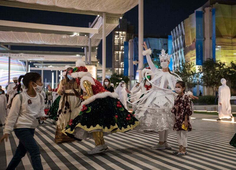 Performers with their Christmas costume entertain crowd at the  EXPO 2020 Dubai.  Leslie Pableo for The National