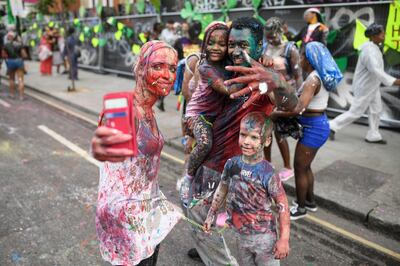 LONDON, ENGLAND - AUGUST 27:  Paint-covered revellers take part in the traditional "J'ouvert" opening parade of the Notting Hill carnival on August 27, 2017 in London, England.  (Photo by Leon Neal/Getty Images)