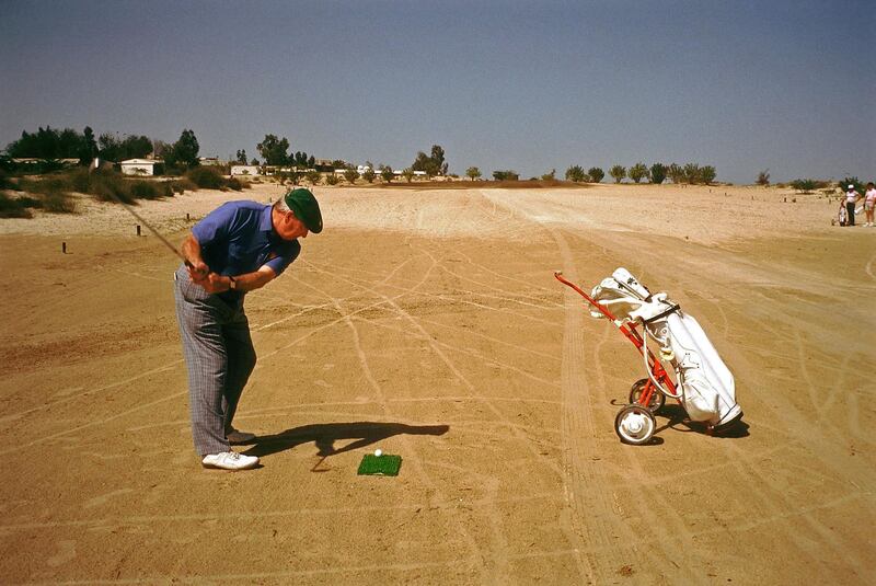 Teeing off on the 9th fairway of the Sand Golf Course at the Dubai Country in the United Arab Emirates, circa November 1999.  (Photo by Phil Sheldon/Popperfoto/Getty Images)