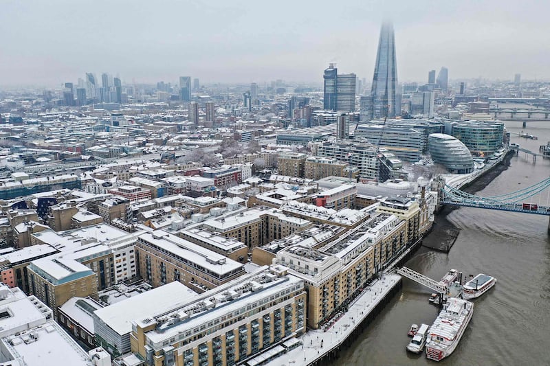 Snow-covered offices and buildings including the Shard skyscraper on the south bank of the Thames. AFP