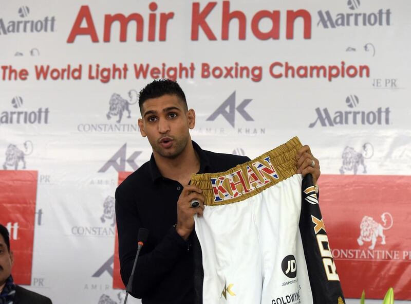 Amir Khan will auction items to re-build a school. Aamir Qureshi / AFP


