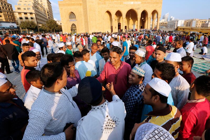 epa06176017 Muslims from the Bangladeshi community in Lebanon exchange Eid greetings after the Eid al-Adha prayers in front of the Al-Ameen Mosque in central Beirut, Lebanon 01 September 2017. Eid al-Adha is one of the most important feasts on the Muslim calendar. It marks the yearly Muslim pilgrimage (Hajj) to Mecca, the holiest place in Islam. On the occasion Muslims slaughter sacrificial animals and split the meat into three parts, one for the family, one for friends and relatives, and one for the poor and needy. The slaughter commemorates the biblical story of Abraham, who was on the verge of sacrificing his son Ismail to obey God's command when God interceded by substituting a ram in the child's place.  EPA/NABIL MOUNZER