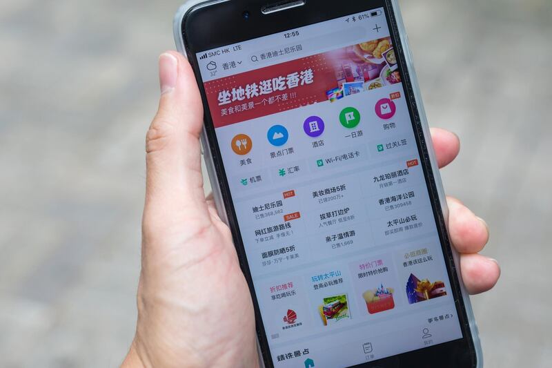 Menu icons are displayed on the Meituan application on an Apple Inc. iPhone in an arranged photograph taken in Hong Kong, China, on Thursday, Sept. 6, 2018. Meituan Dianping started taking orders for a Hong Kong initial public offering that could raise as much as $4.4 billion as it warned there was no guarantee it would ever become profitable. Photographer: Paul Yeung/Bloomberg