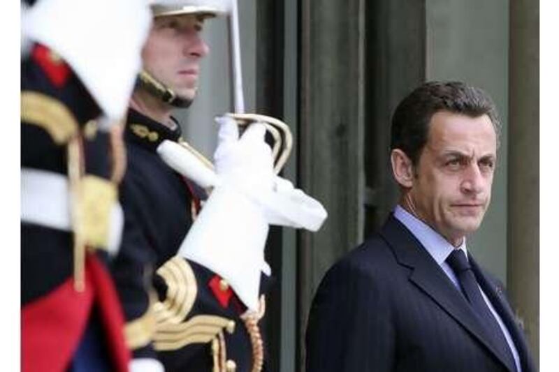 Nicolas Sarkozy awaits foreign dignitaries at the Elysée Palace in Paris.
