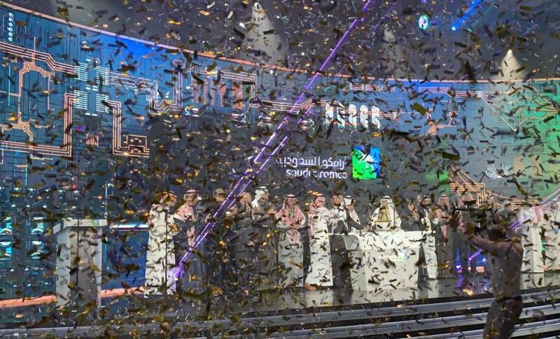 Participants celebrate during the official ceremony marking the debut of Saudi Aramco on the Riyadh stock market on Wednesday. Reuters