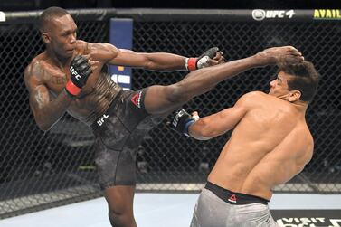 ABU DHABI, UNITED ARAB EMIRATES - SEPTEMBER 27: (L-R) Israel Adesanya of Nigeria kicks the head of Paulo Costa of Brazil in their middleweight championship bout during UFC 253 inside Flash Forum on UFC Fight Island on September 27, 2020 in Abu Dhabi, United Arab Emirates. (Photo by Josh Hedges/Zuffa LLC)