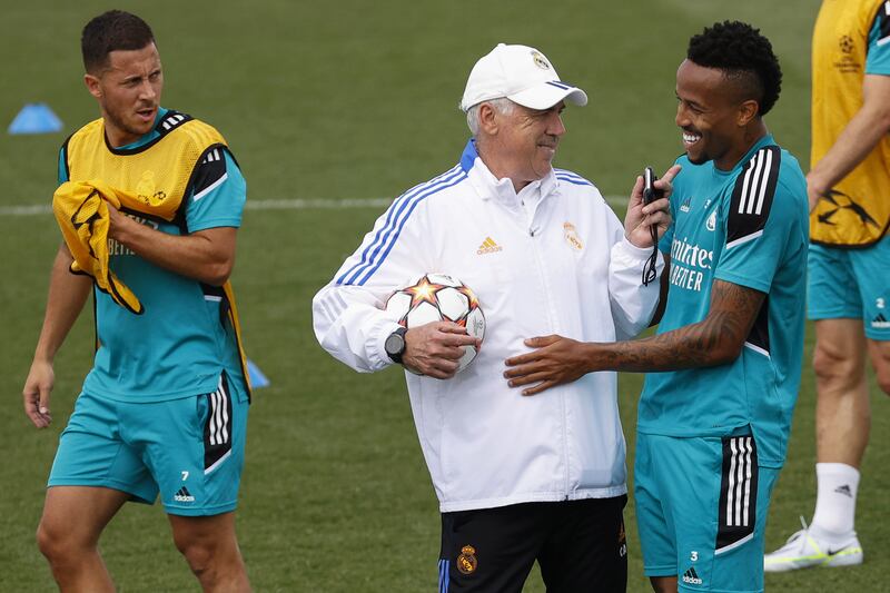 Real Madrid head coach Carlo Ancelotti gives instructions to Eder Militao during training for the Champions League final. EPA 