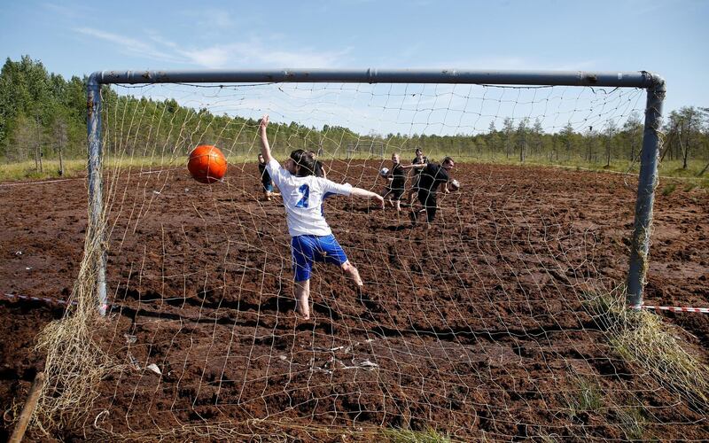 Soccer enthusiasts compete in the Swamp Football Cup of Russia in the village of Pogi in Leningrad Region, Russia. Anton Vaganov / Reuters