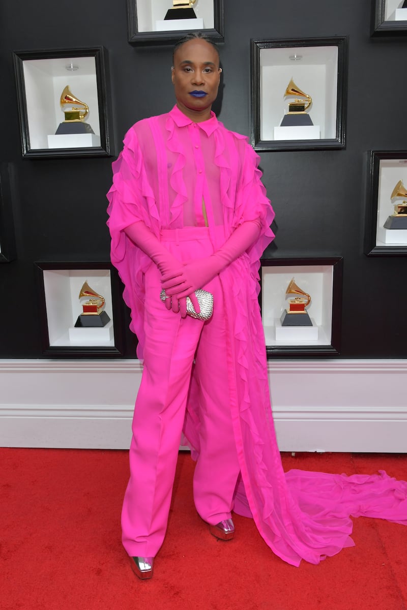 Billy Porter wearing a long pink shirt over trousers to the Grammy Awards in April. Getty