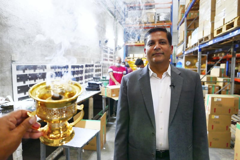 SHARJAH, UNITED ARAB EMIRATES , April 14  – 2021 :- Nader Adam Ali, Director showing the burning of bakhoor tablets  at the Swiss Arabian perfume and Bakhoor factory in Sharjah. ( Pawan Singh / The National ) For News/Online/Instagram. Story by Kelly