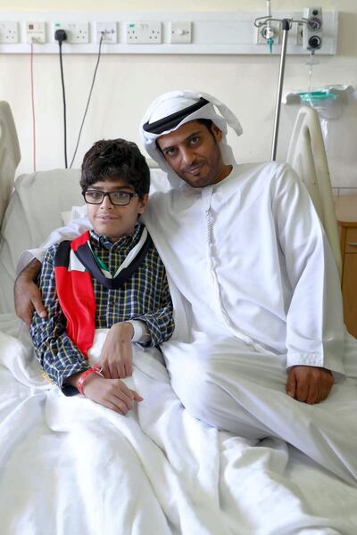 14 year old Zayed Al Kaabi with his father Omar Al Kaabi, who donated his kidney for the successful surgery. Courtesy SKMC