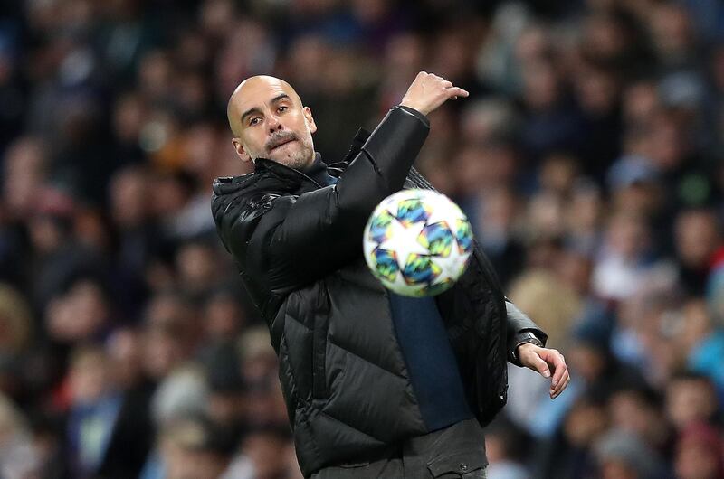 MANCHESTER, ENGLAND - OCTOBER 01: Pep Guardiola, Manager of Manchester City throws the ball during the UEFA Champions League group C match between Manchester City and Dinamo Zagreb at Etihad Stadium on October 01, 2019 in Manchester, United Kingdom. (Photo by Alex Pantling/Getty Images)